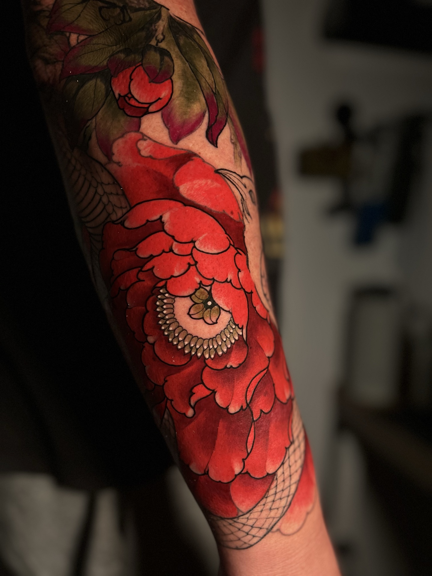 Red peony colour sleeve tattoo by Levi Taylor